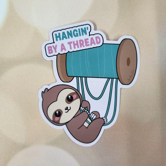 Hangin By a Thread Sticker